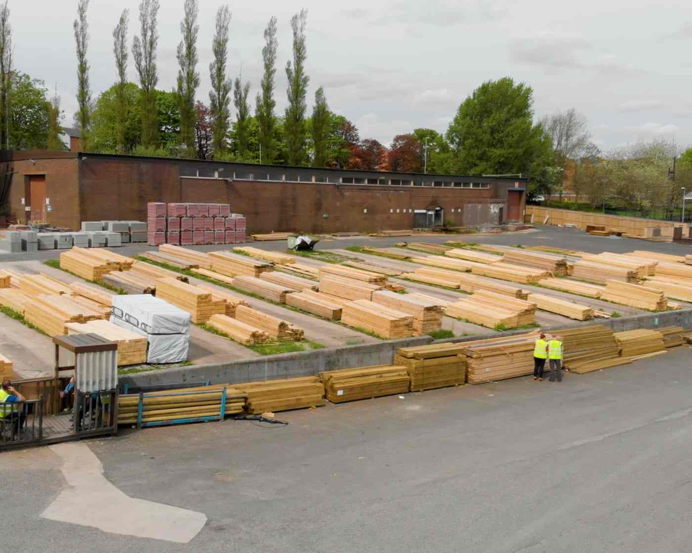 Banded packs of dimensional lumber stacked in a covered yard